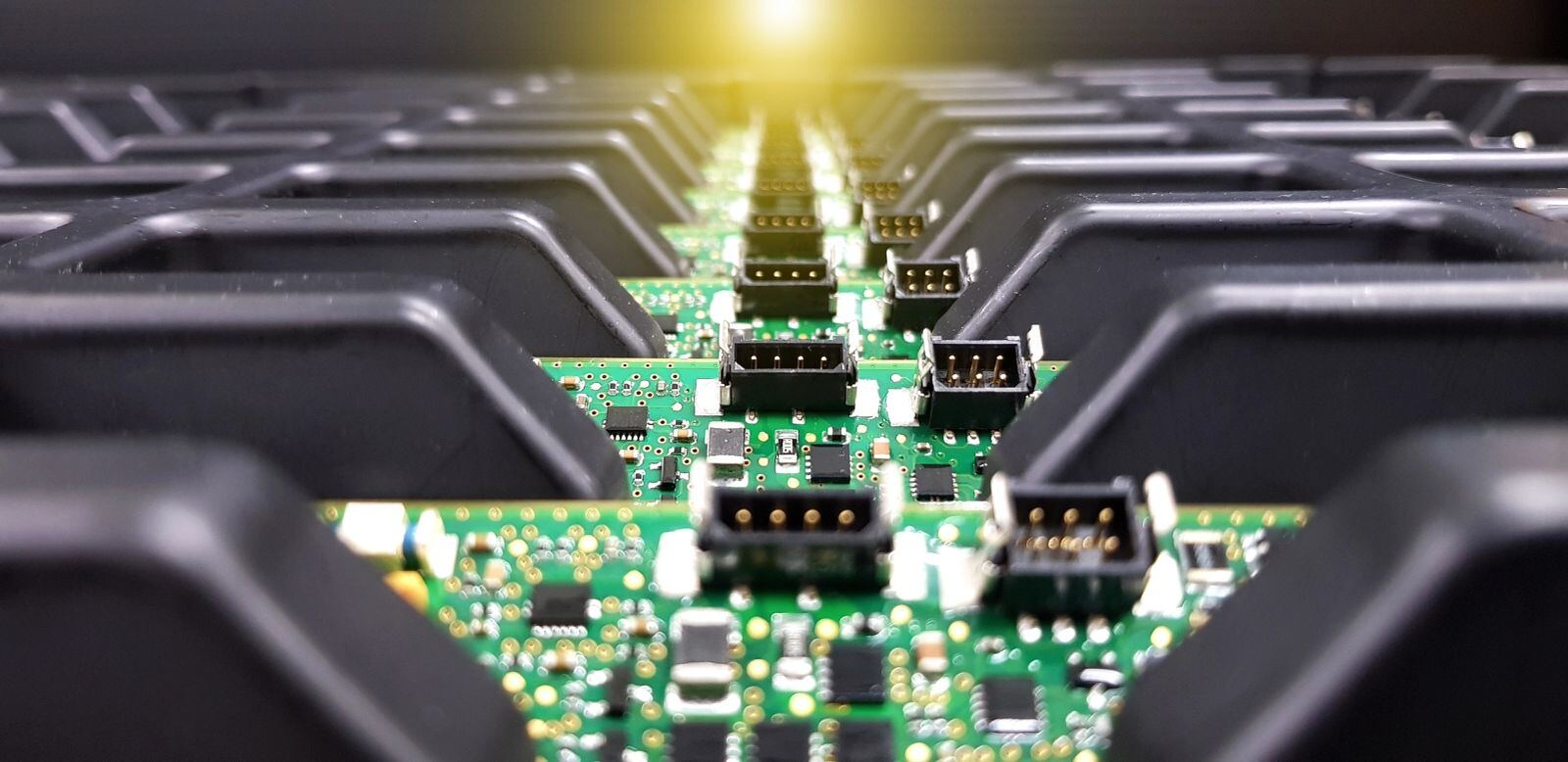 Row of assembled circuit boards with connectors